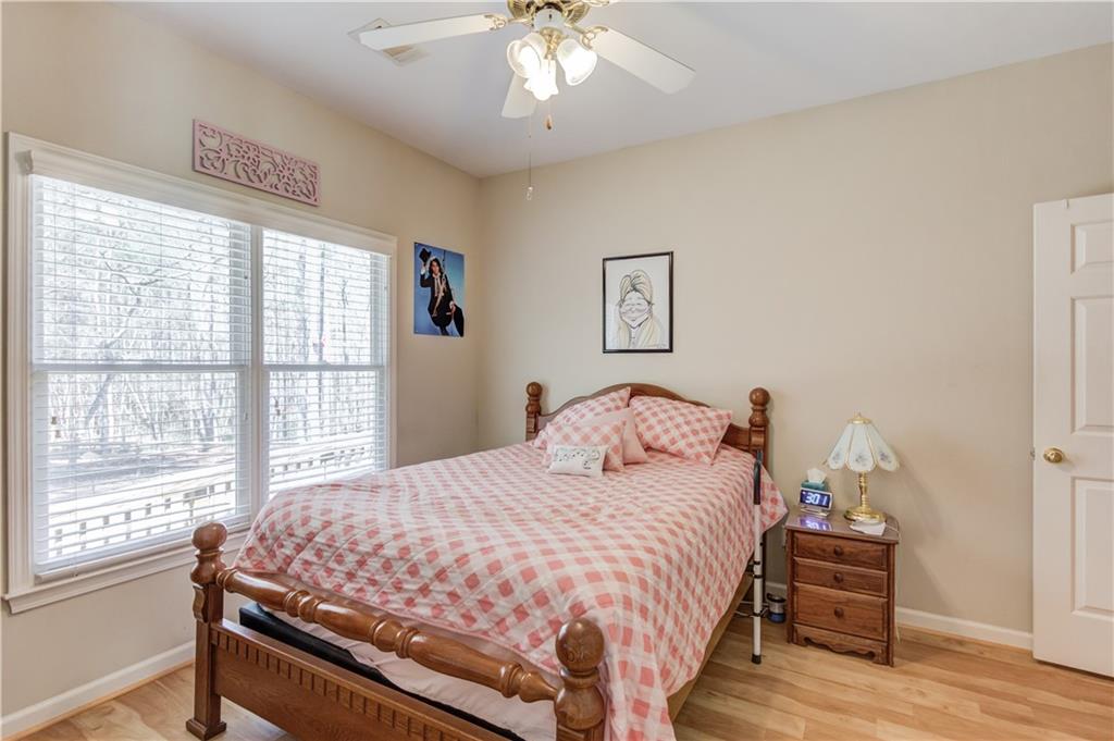 8012 Cypress Point Monroe, GA 30656 - Photo 33 of 67 a bedroom with a bed and a window