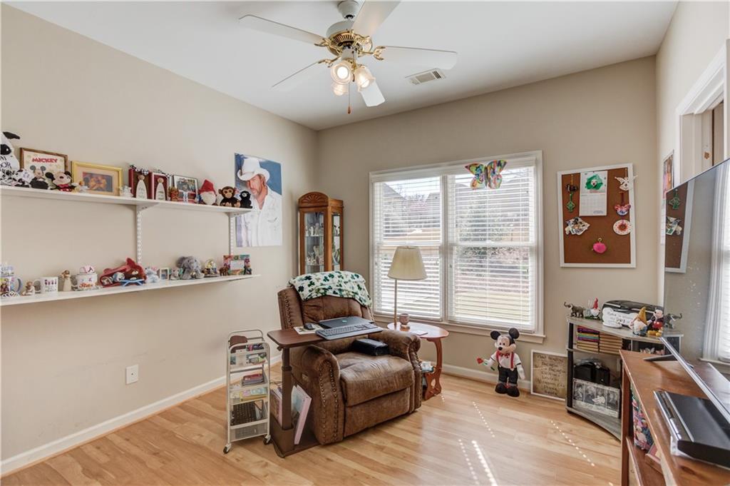 8012 Cypress Point Monroe, GA 30656 - Photo 37 of 67 a living room with furniture and a window