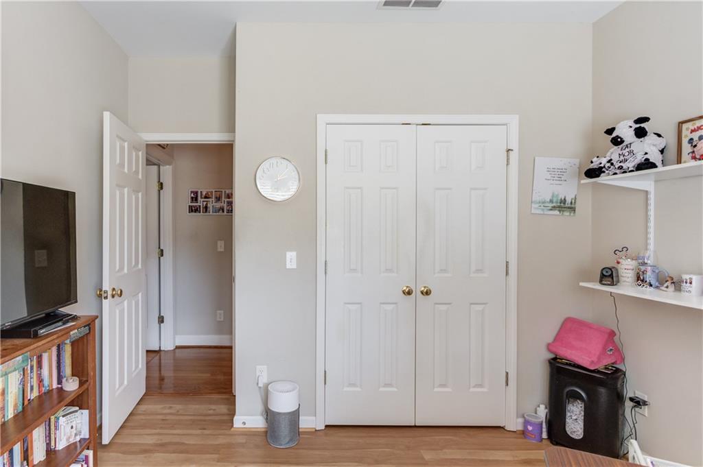 8012 Cypress Point Monroe, GA 30656 - Photo 38 of 67 a view of a room with wooden floor and a flat screen tv