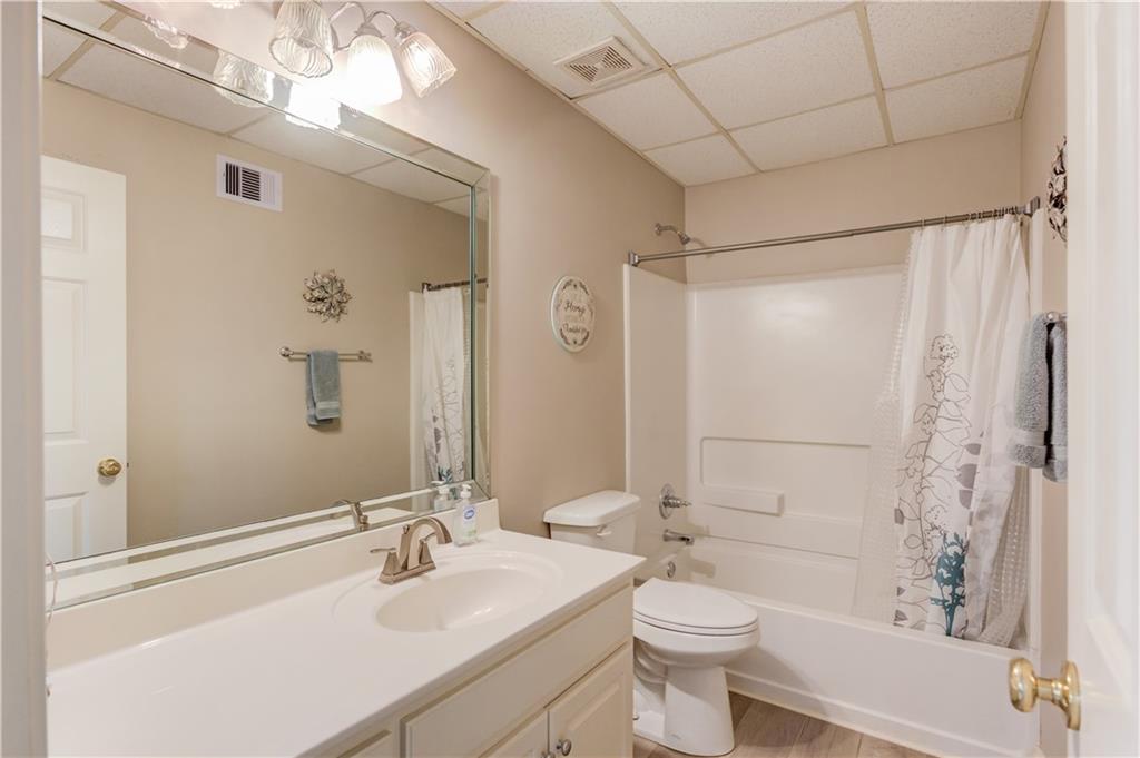 8012 Cypress Point Monroe, GA 30656 - Photo 46 of 67 a bathroom with a sink a toilet and shower