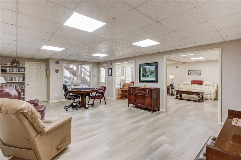 8012 Cypress Point Monroe, GA 30656 - Photo 5 of 67 a living room with furniture and a wooden floor