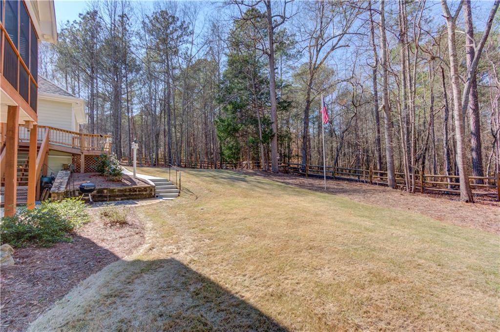 8012 Cypress Point Monroe, GA 30656 - Photo 58 of 67 a view of a backyard with large trees
