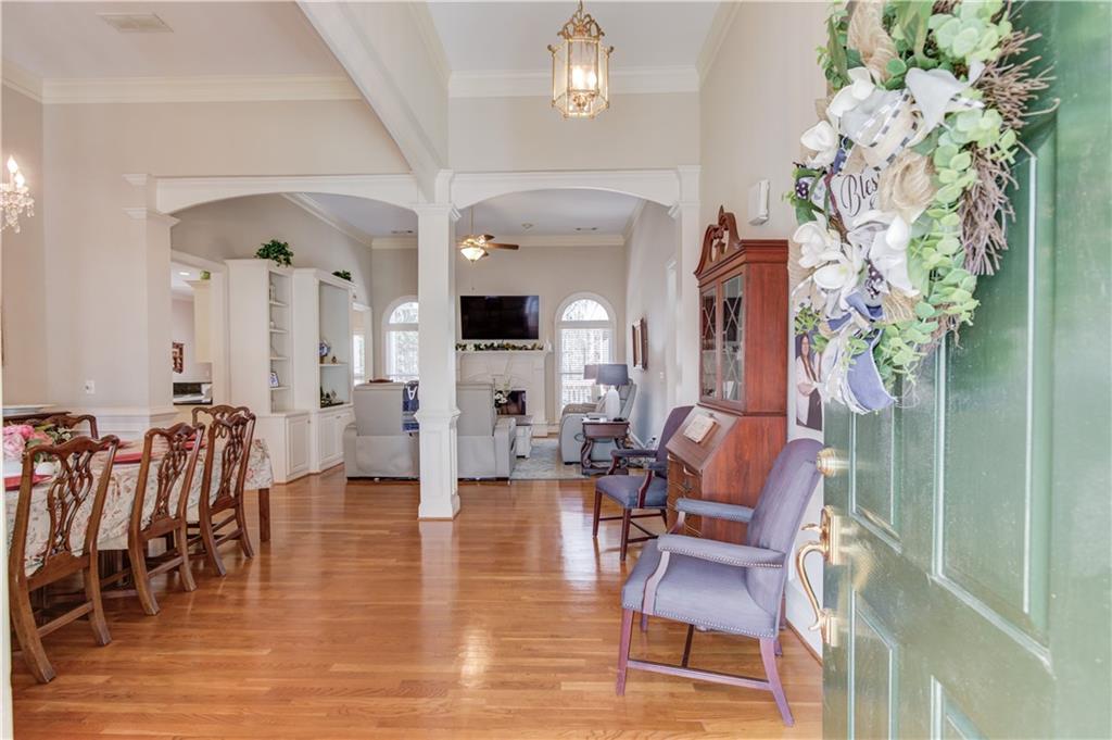 8012 Cypress Point Monroe, GA 30656 - Photo 10 of 67 a living room with furniture and a chandelier