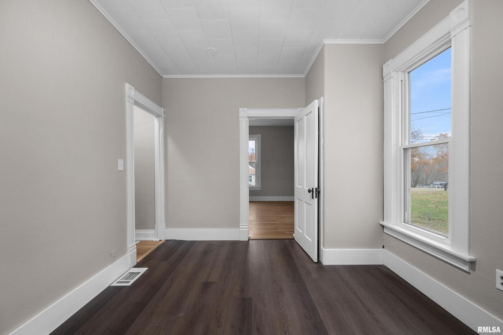 405 North Bluff Street Albany, IL 61230 - Photo 14 of 31 wooden floor in an empty room with a window