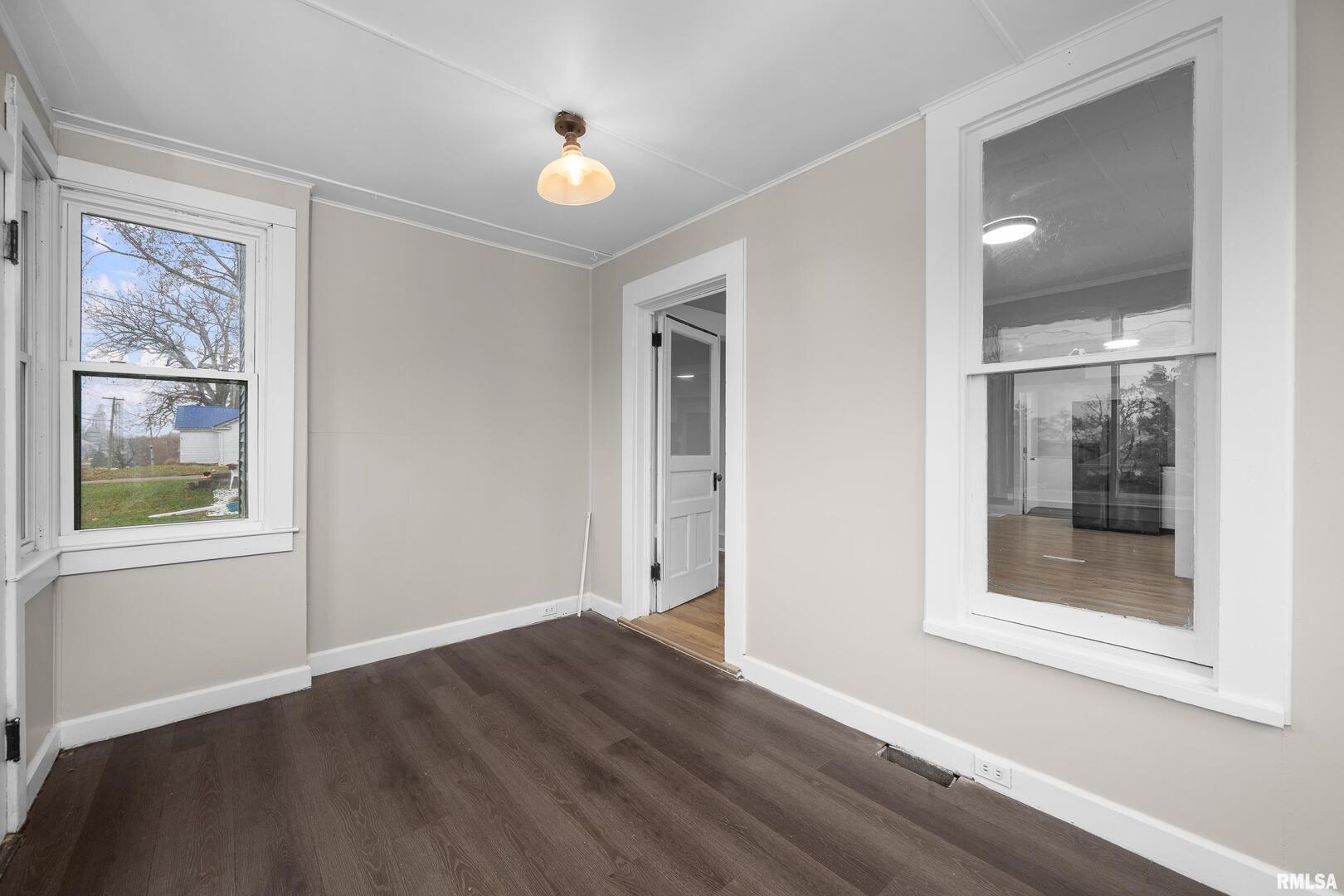 405 North Bluff Street Albany, IL 61230 - Photo 17 of 31 a view of an empty room with window and wooden floor