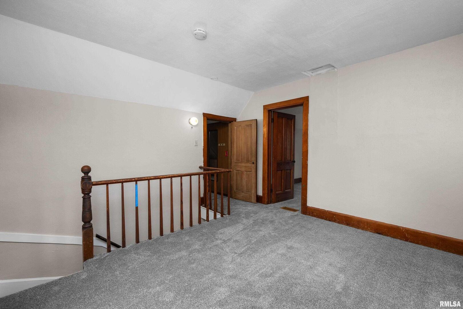 405 North Bluff Street Albany, IL 61230 - Photo 18 of 31 a view of an empty room with wooden floor