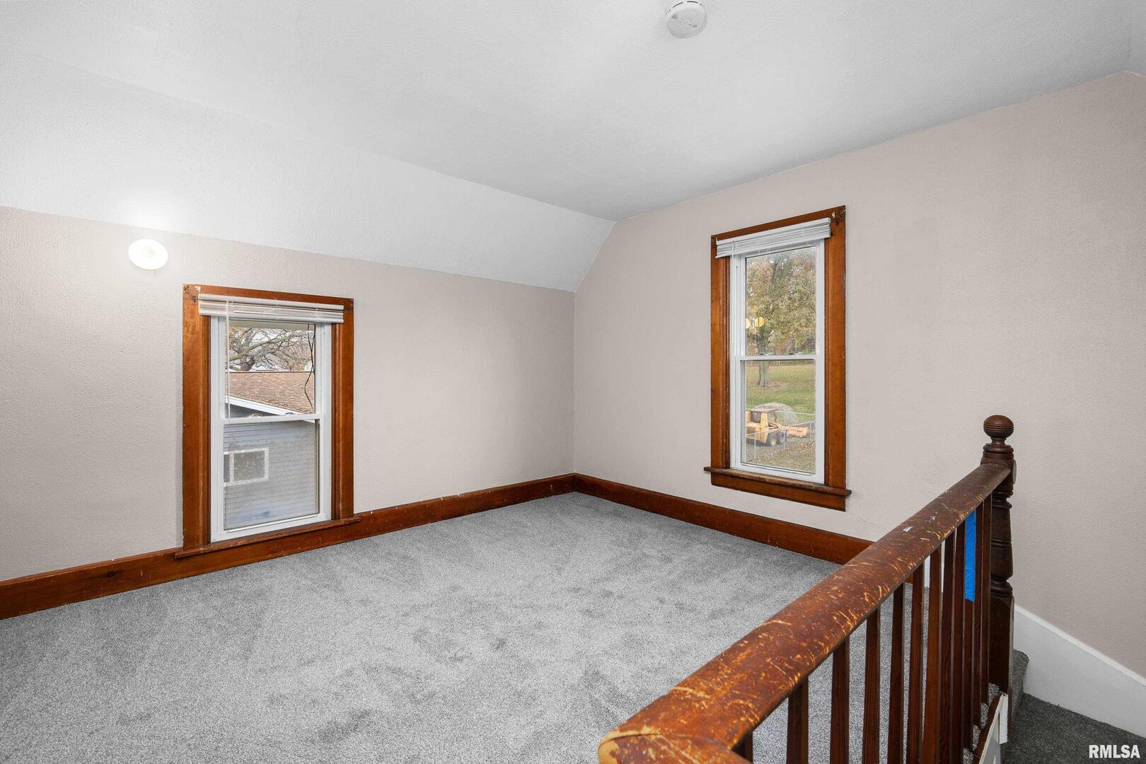 405 North Bluff Street Albany, IL 61230 - Photo 19 of 31 a view of an empty room with window and stairs