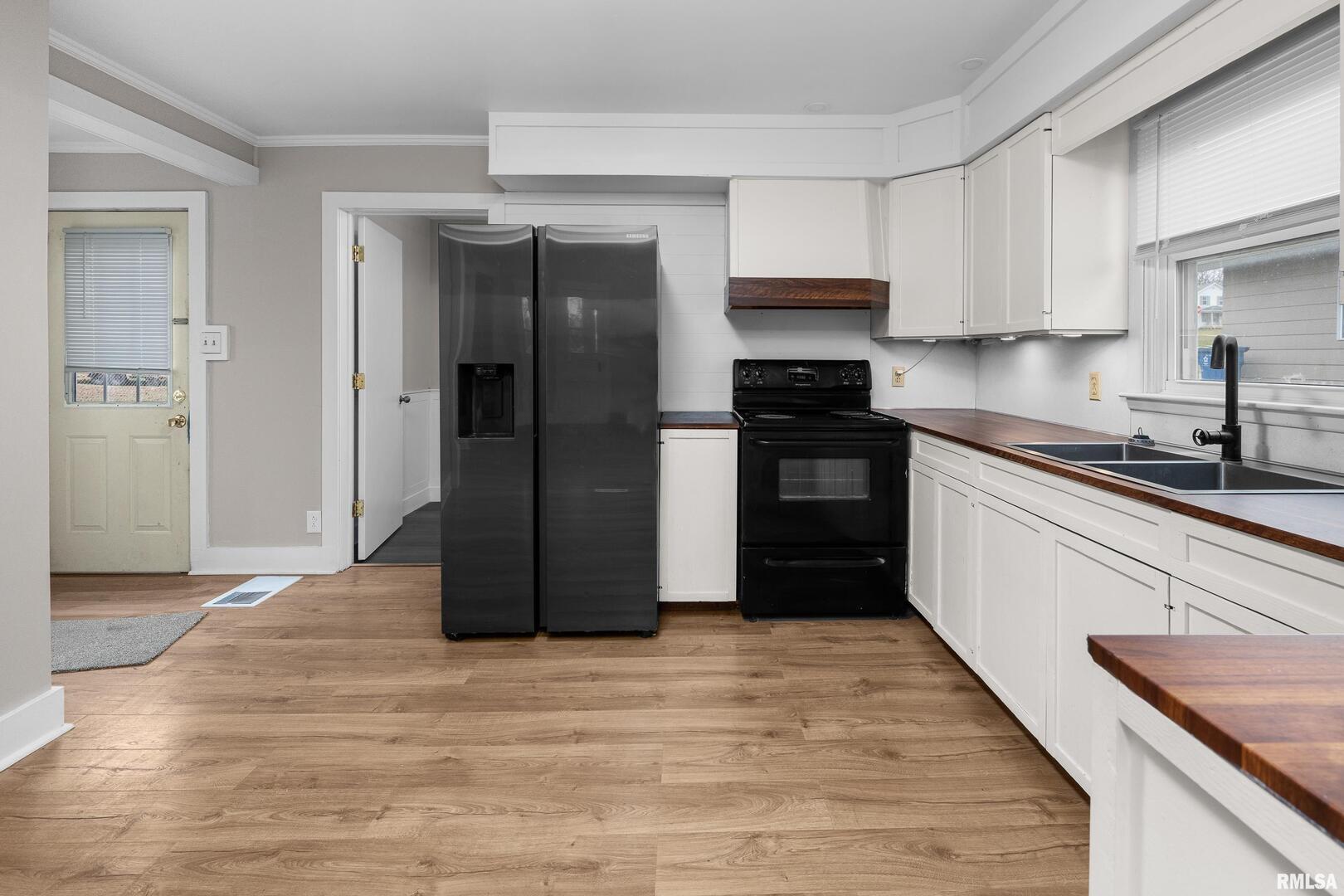 405 North Bluff Street Albany, IL 61230 - Photo 5 of 31 a kitchen with stainless steel appliances granite countertop a refrigerator and a stove