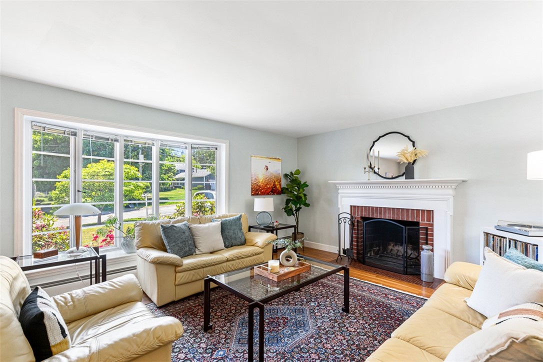 71 Primrose Hill Road Barrington, RI 02806 - Photo 8 of 49 Wood burning fireplace with abundant light streaming through beautiful windows.