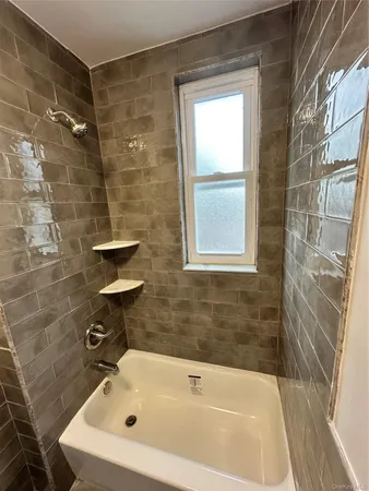 a bathroom with a bath tub