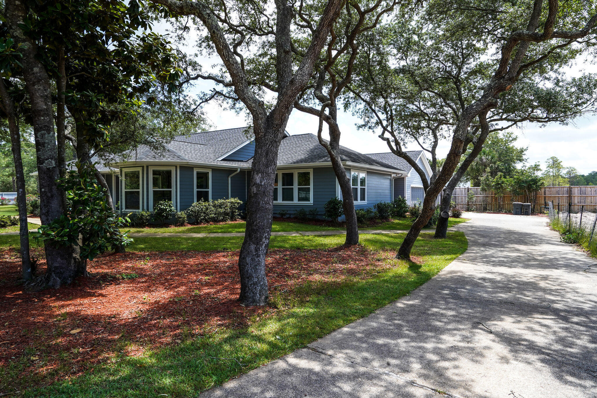 a view of a house with a backyard