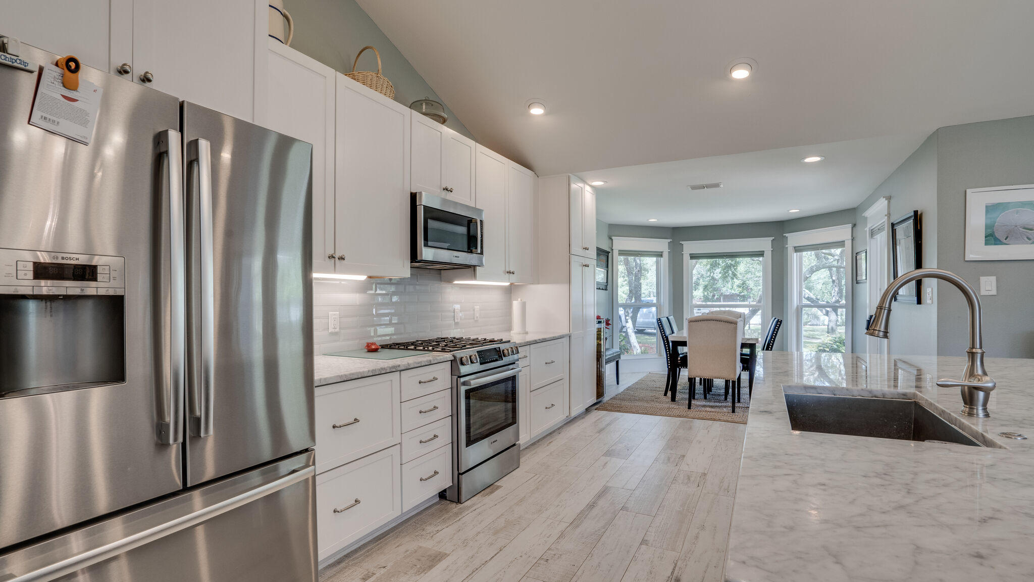 786 Mack Bayou Road Santa Rosa Beach, FL 32459 - Photo 13 of 42 a kitchen with granite countertop a refrigerator stove and sink
