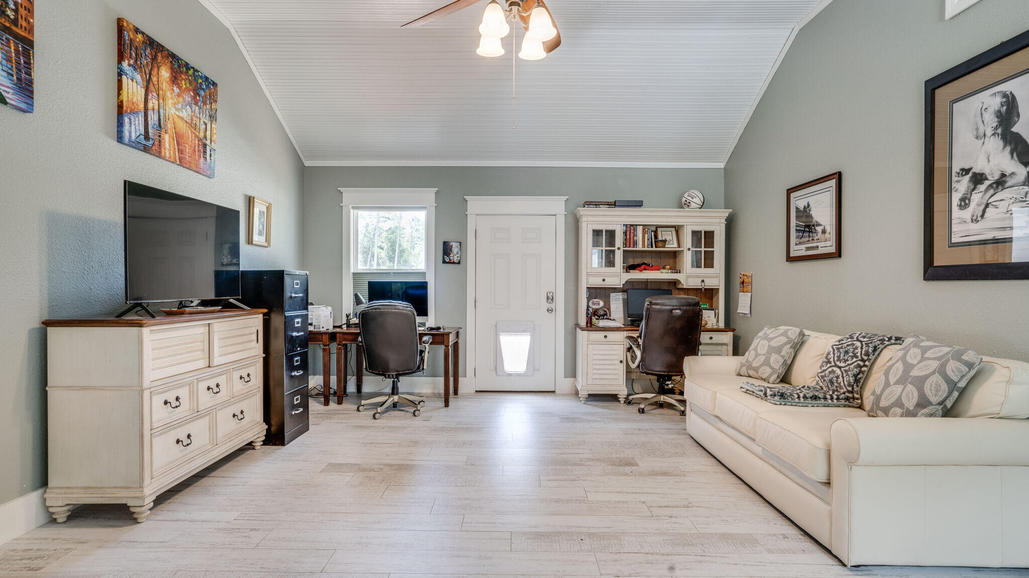 786 Mack Bayou Road Santa Rosa Beach, FL 32459 - Photo 17 of 42 a living room with furniture and a flat screen tv