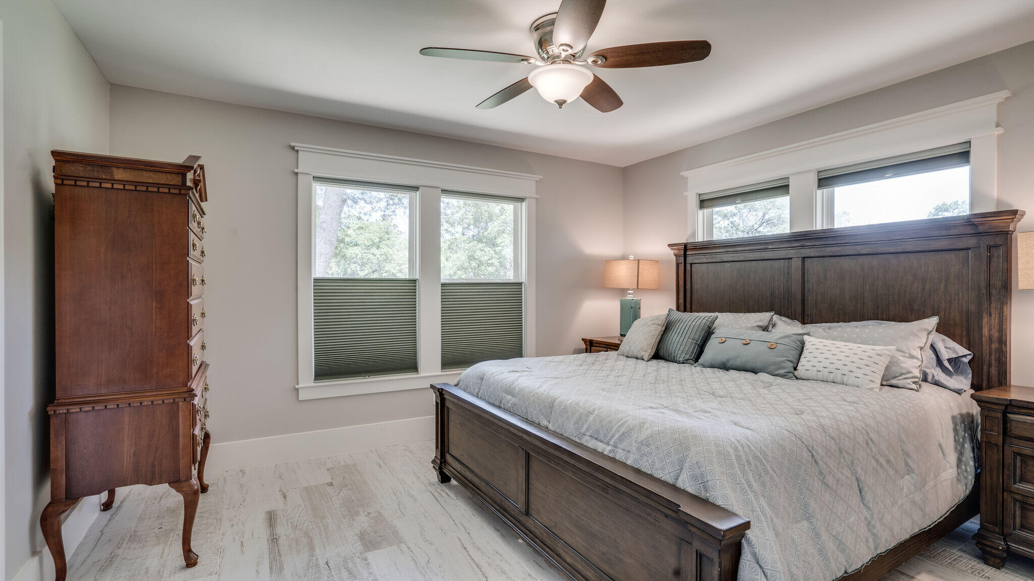 786 Mack Bayou Road Santa Rosa Beach, FL 32459 - Photo 26 of 42 a bedroom with a bed and a chandelier
