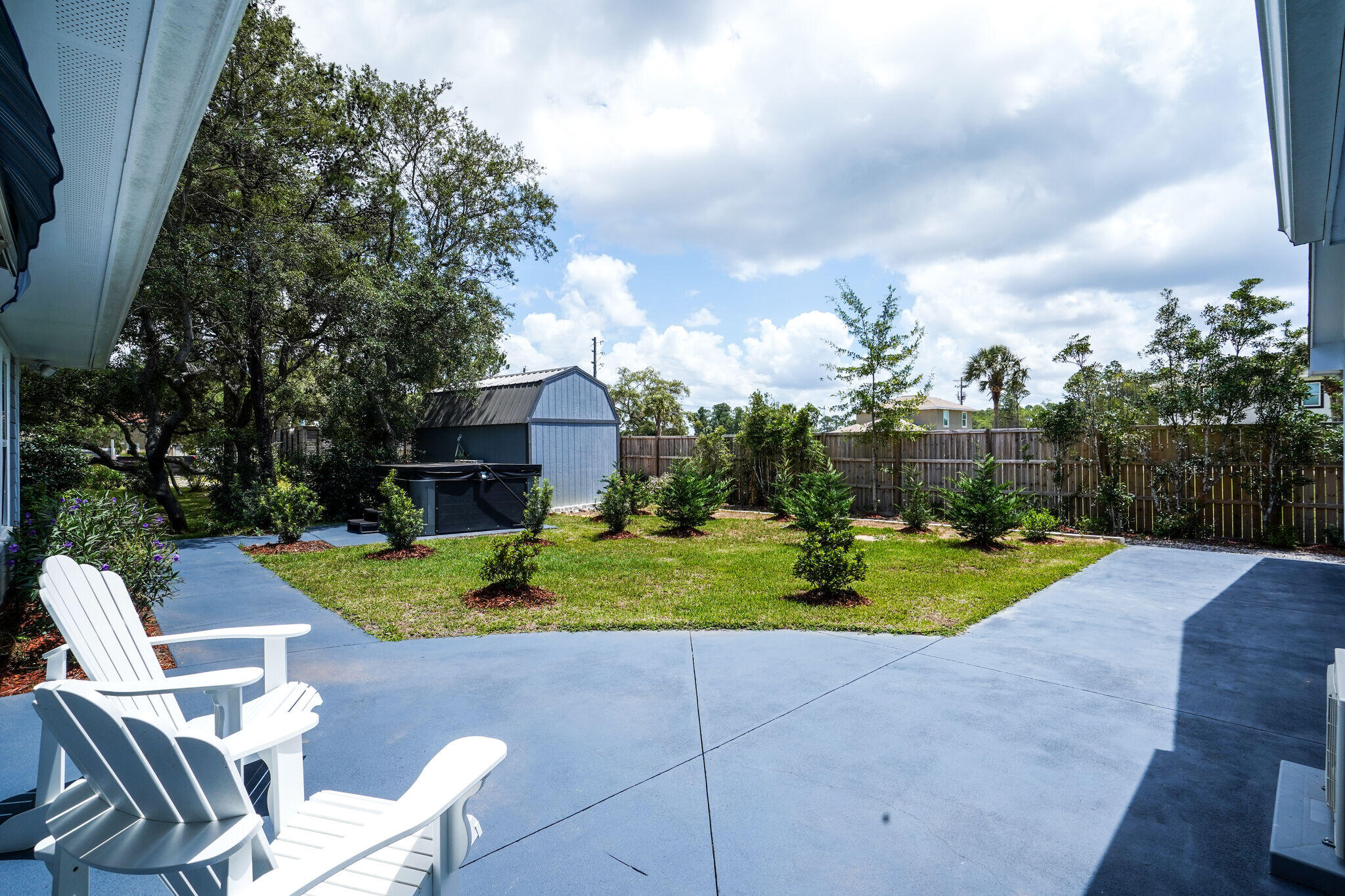 786 Mack Bayou Road Santa Rosa Beach, FL 32459 - Photo 30 of 42 a view of a two chairs in a backyard
