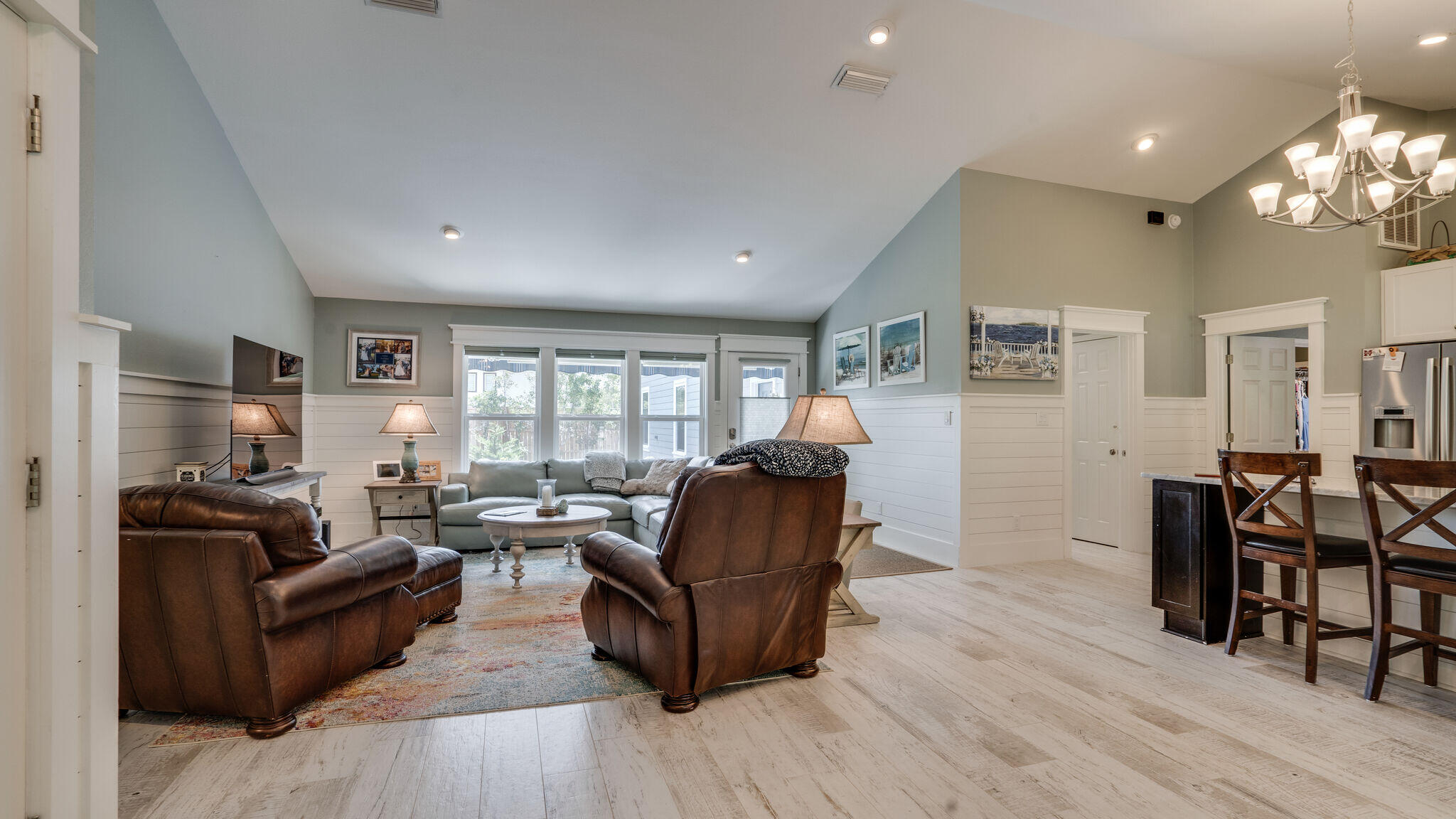 786 Mack Bayou Road Santa Rosa Beach, FL 32459 - Photo 3 of 42 a living room with furniture and a wooden floor