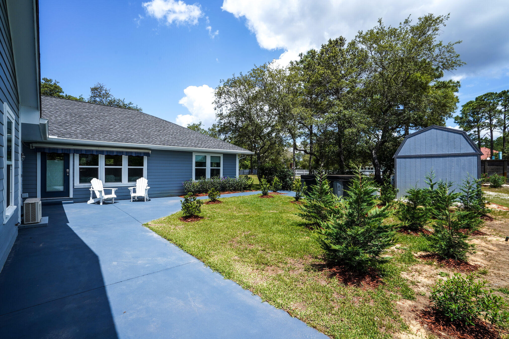 786 Mack Bayou Road Santa Rosa Beach, FL 32459 - Photo 32 of 42 a front view of a house with garden and porch
