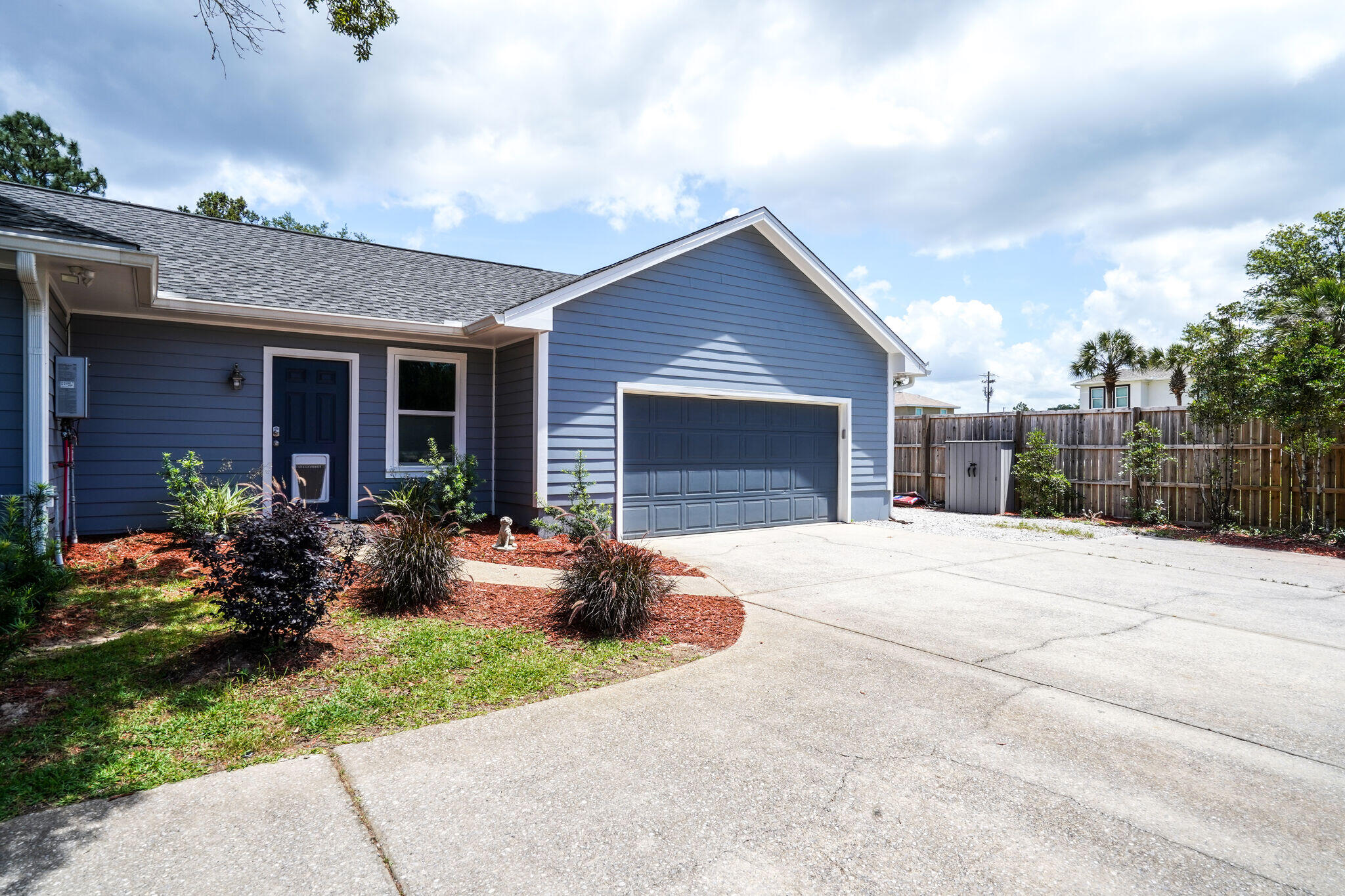786 Mack Bayou Road Santa Rosa Beach, FL 32459 - Photo 35 of 42 a front view of house with yard outdoor seating and barbeque oven