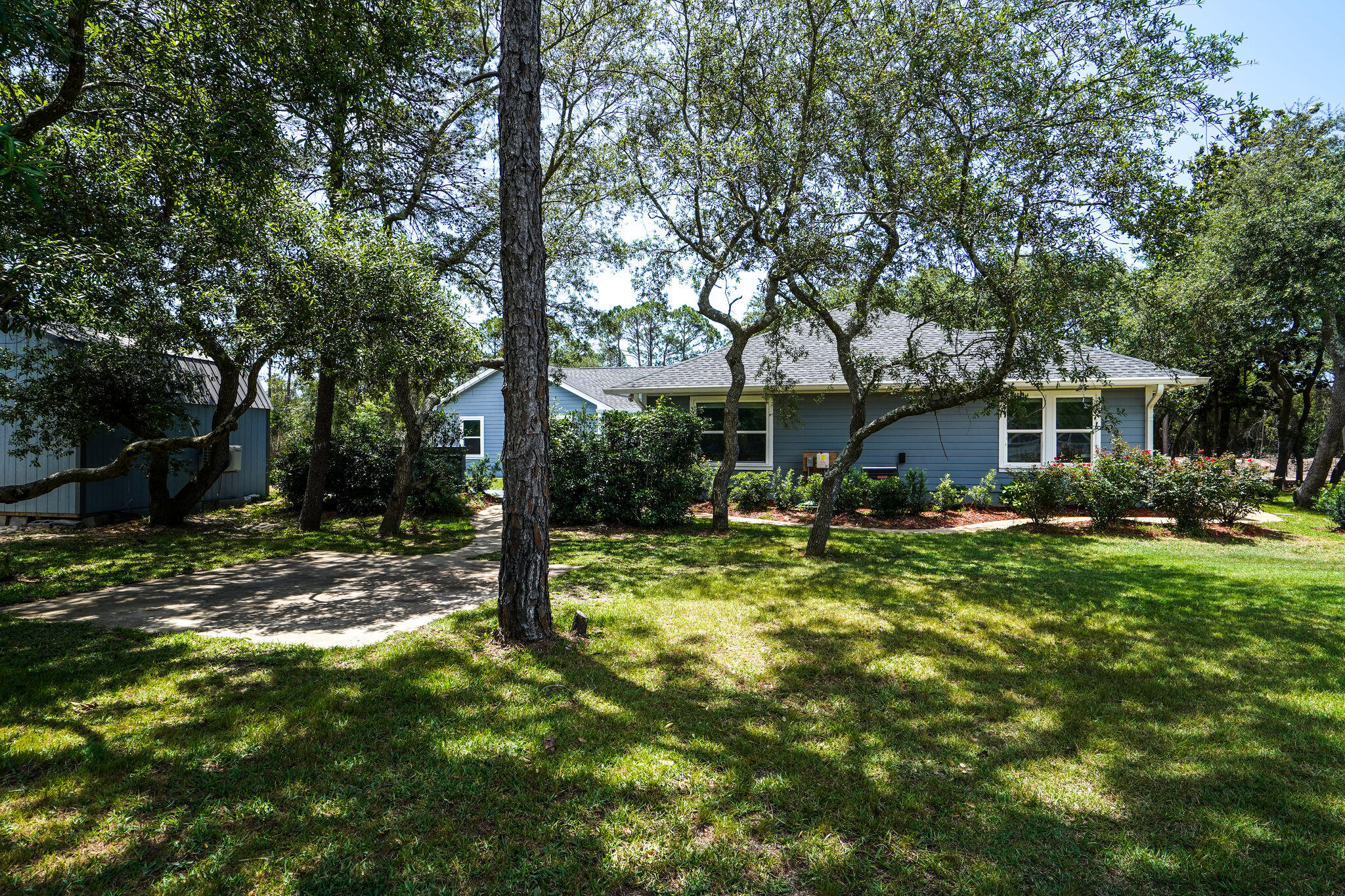 786 Mack Bayou Road Santa Rosa Beach, FL 32459 - Photo 39 of 42 a view of a house with a yard