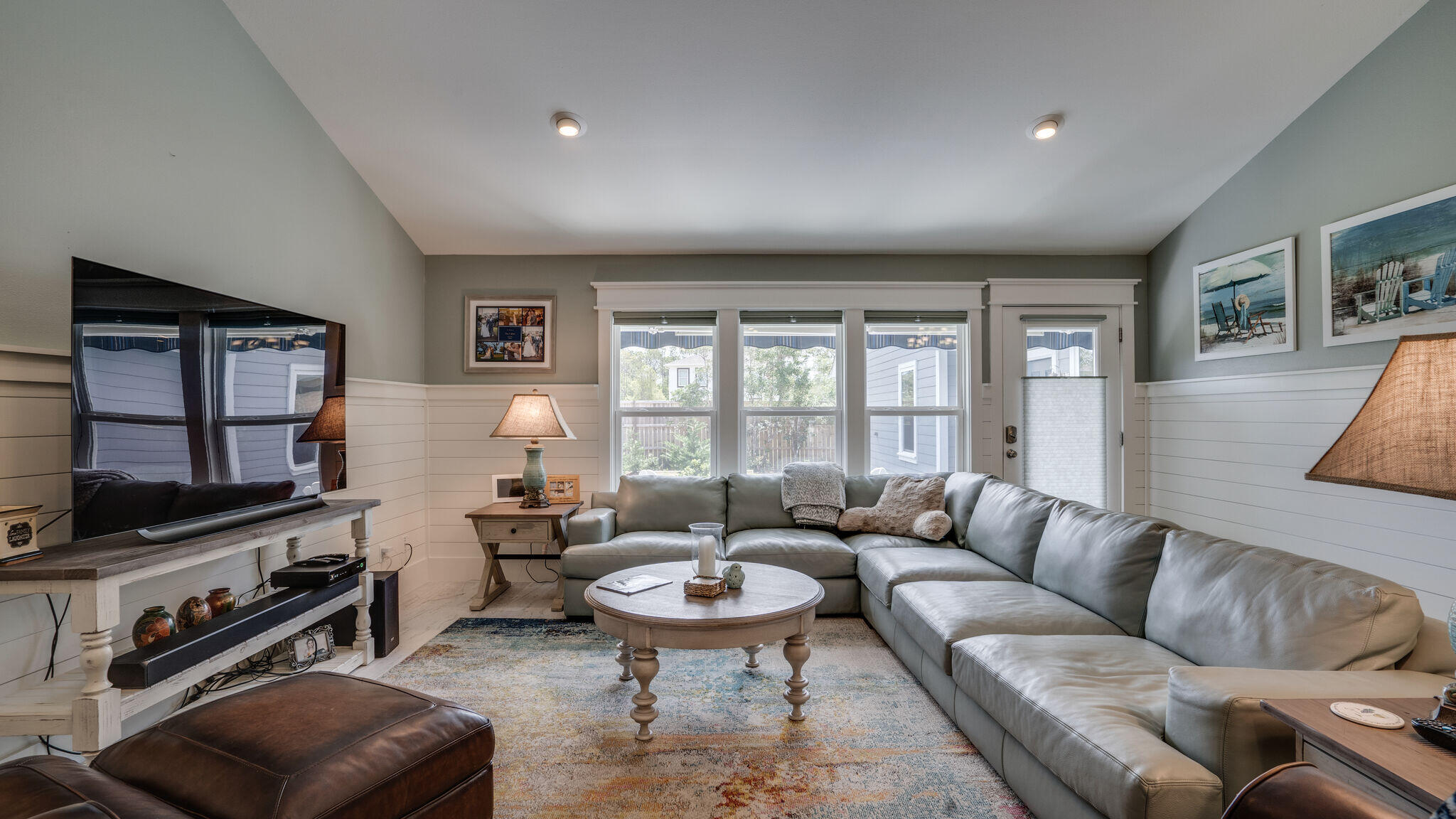 786 Mack Bayou Road Santa Rosa Beach, FL 32459 - Photo 6 of 42 a living room with furniture a flat screen tv and a window