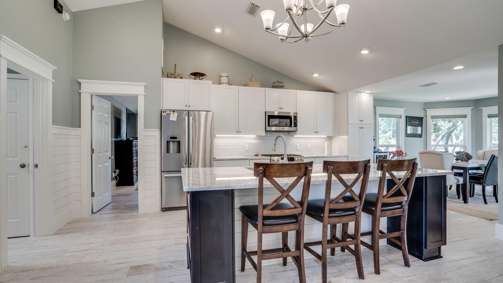 786 Mack Bayou Road Santa Rosa Beach, FL 32459 - Photo 8 of 42 a large kitchen with a table and chairs