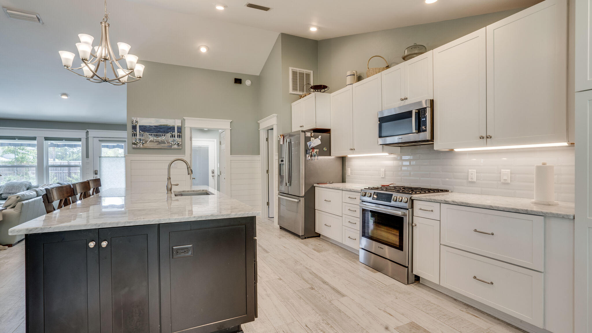 786 Mack Bayou Road Santa Rosa Beach, FL 32459 - Photo 10 of 42 a kitchen with stainless steel appliances a sink stove and refrigerator