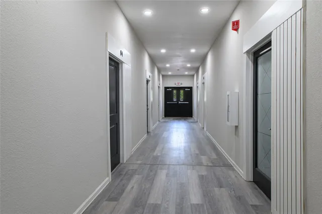 a view of hallway with a large window
