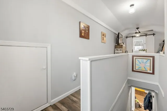 a view of empty room and wooden floor