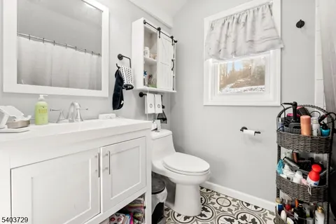 an aerial view of a house with a lake view