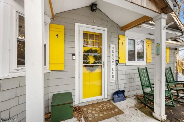 a kitchen with granite countertop a refrigerator stove top oven and sink