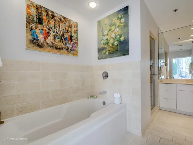 a bathroom with a bathtub and a shower