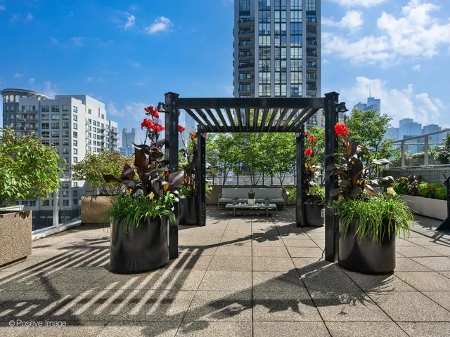 a building with potted plants in front of it