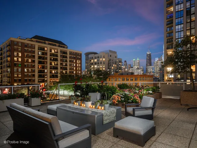 a view of a terrace with couches and a table and chairs
