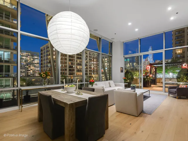 a room with a large window and a table