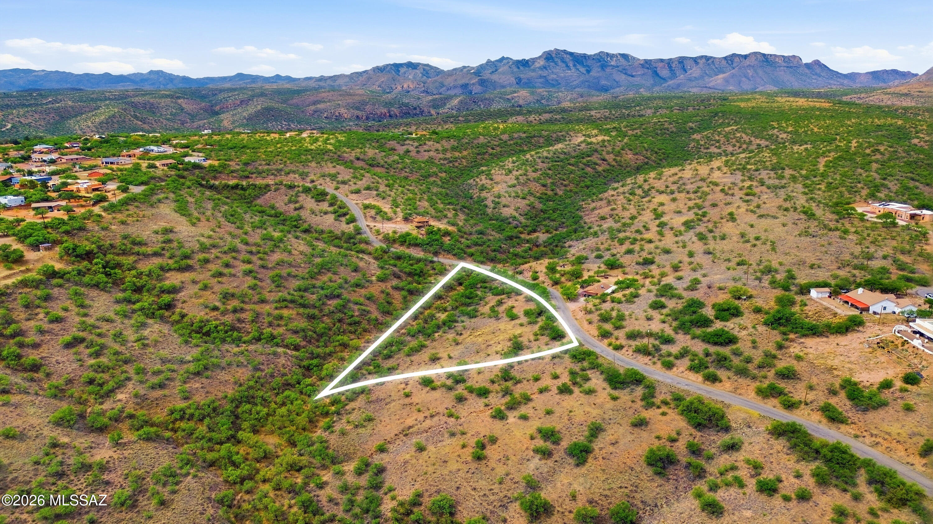 1469 Circulo Jacona Rio Rico, AZ 85648 - Photo 9 of 22 a view of a lush green hillside and a building