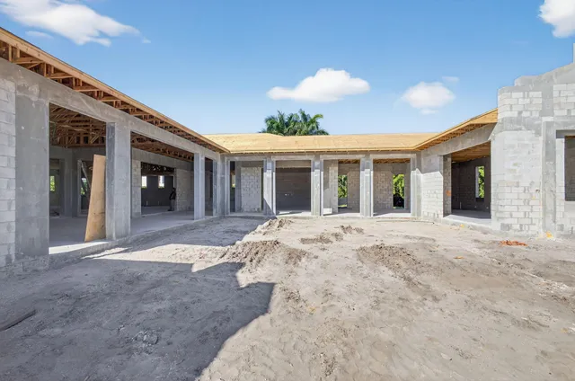 a view of a white house with a outdoor space