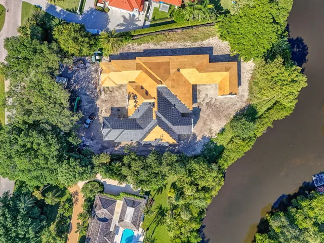 an aerial view of residential house with outdoor space and swimming pool