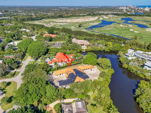 an aerial view of a house with a lake view