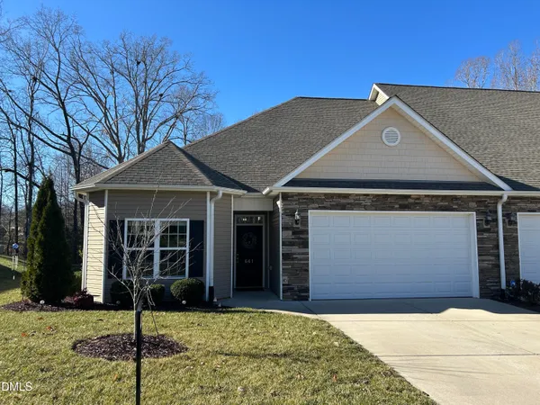 a house with yard in front of it