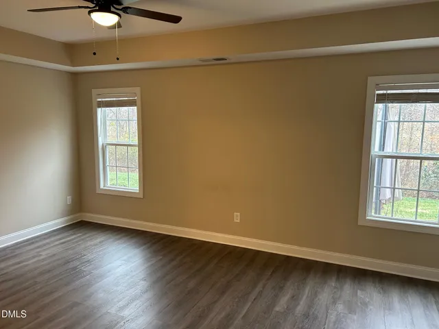 a view of a livingroom with wooden floor