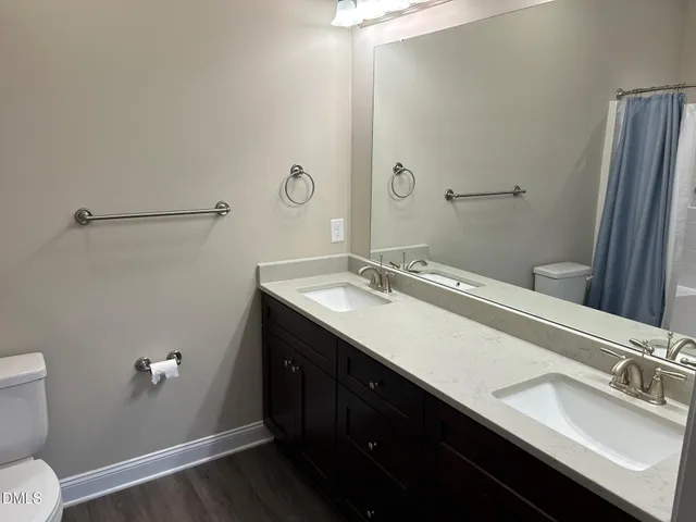 a view of a yard with large trees