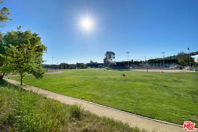 a view of a golf course with a garden