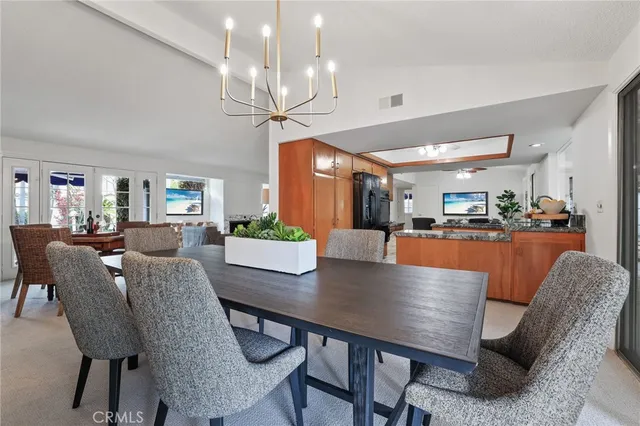 a kitchen with granite countertop a refrigerator and a sink