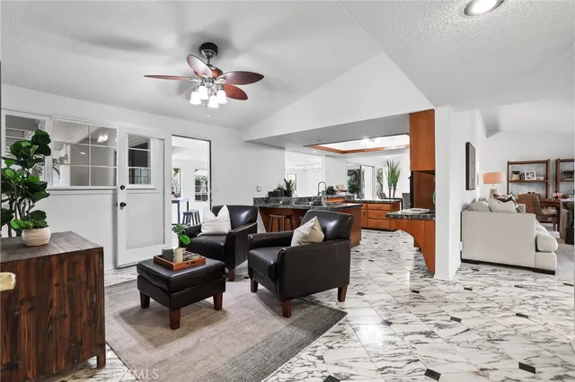 a bed room with a bed and a chair