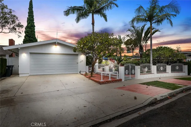 a view of a porch with furniture and garden