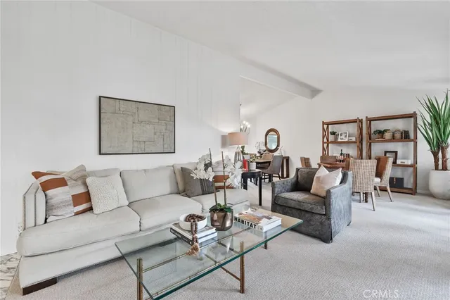 a living room with furniture and a lamp