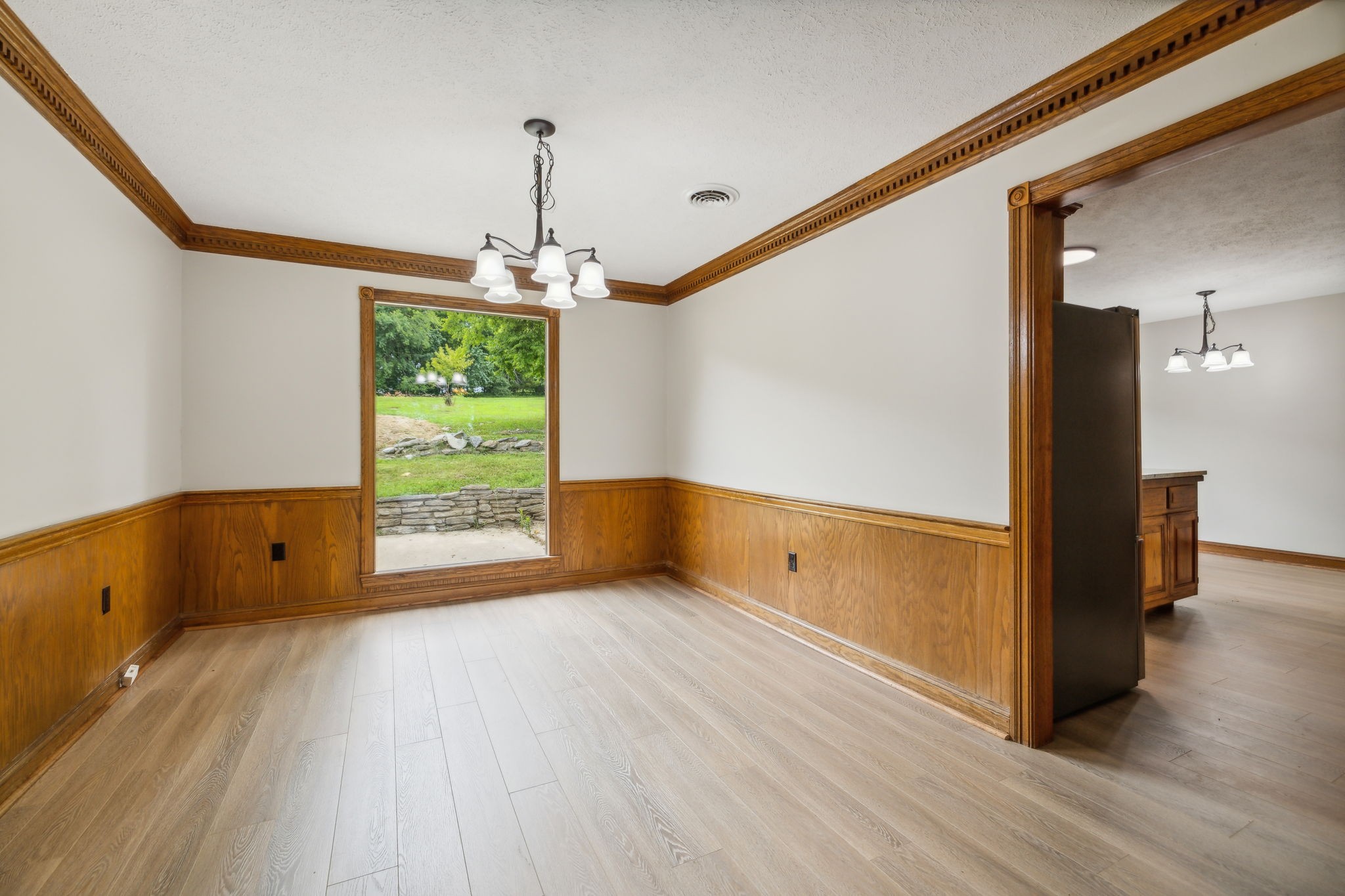 969 Trice Road Lebanon, TN 37087 - Photo 17 of 47 a view of an empty room with wooden floor and a window