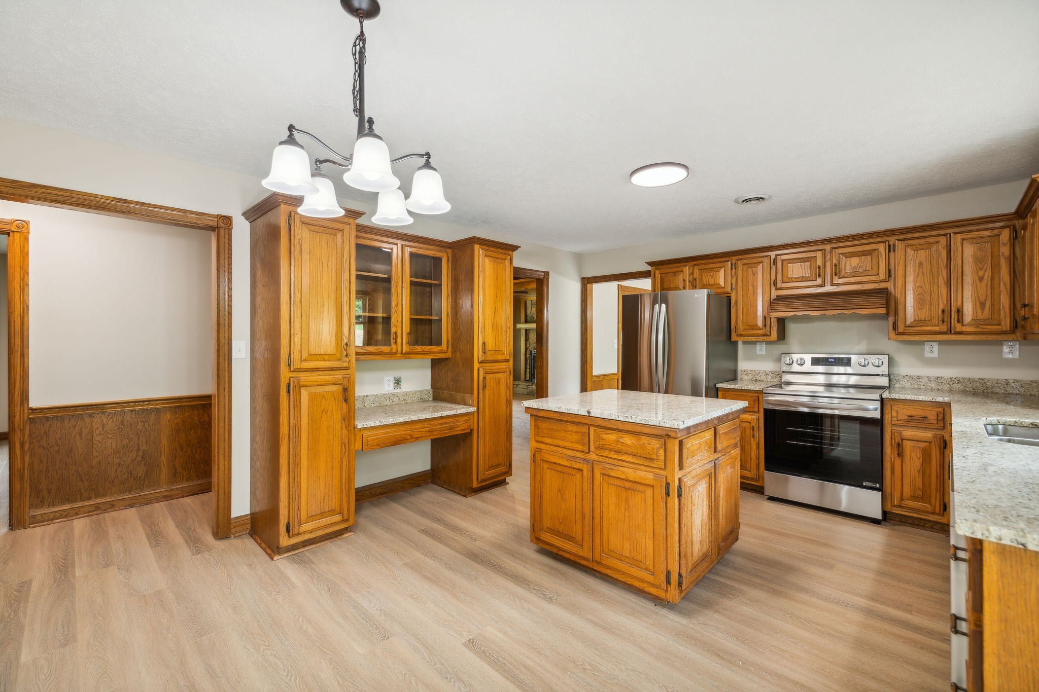 969 Trice Road Lebanon, TN 37087 - Photo 20 of 47 a kitchen with stainless steel appliances granite countertop a stove and cabinets