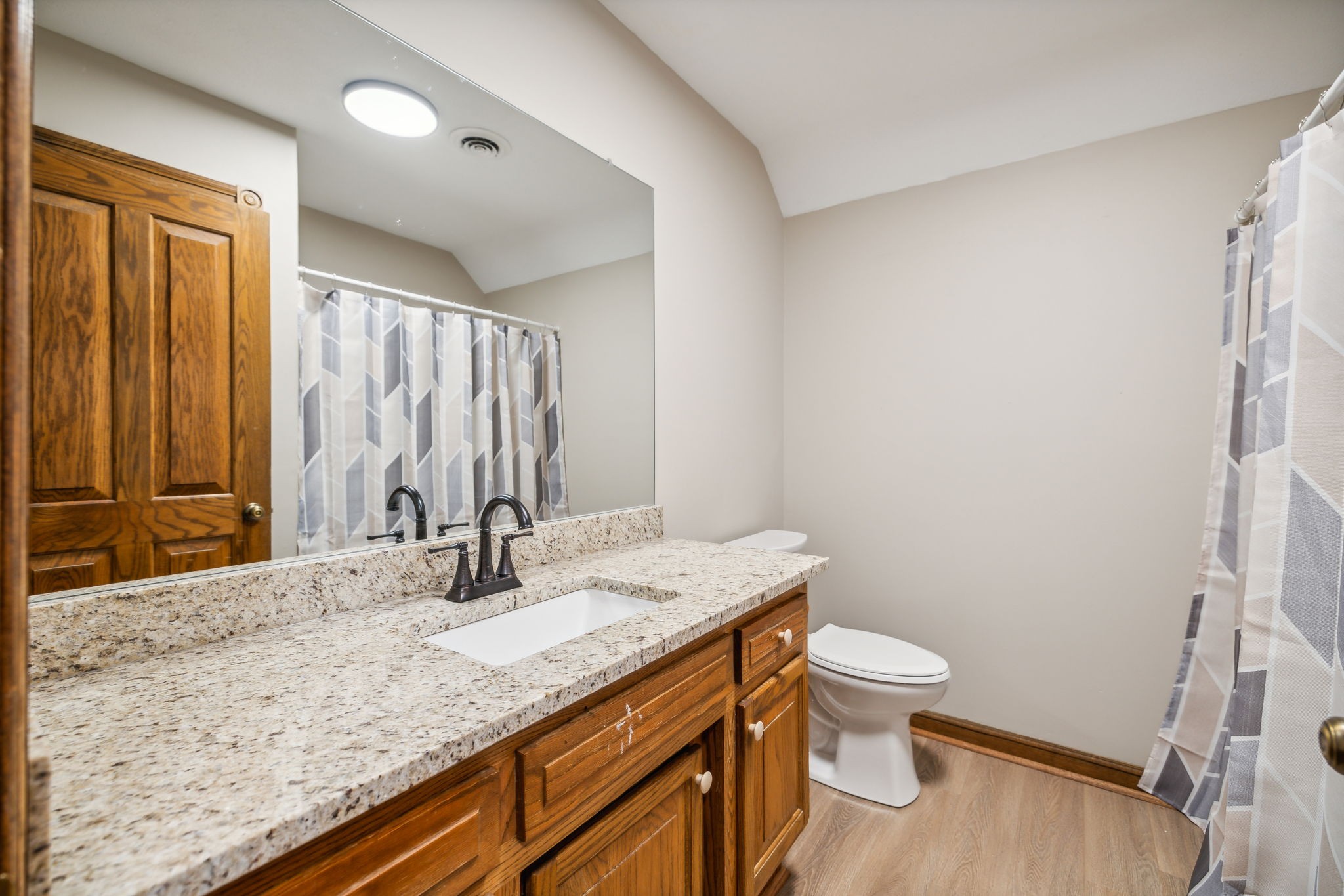 969 Trice Road Lebanon, TN 37087 - Photo 32 of 47 a bathroom with a granite countertop sink toilet and shower