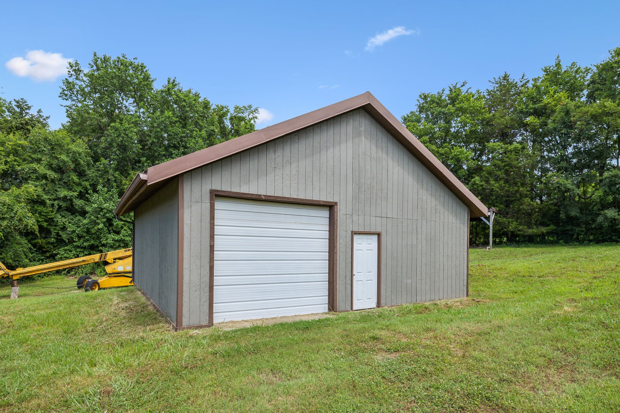 969 Trice Road Lebanon, TN 37087 - Photo 39 of 47 a view of backyard of house with wooden fence and trees